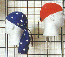 Two mannequin heads wearing Domer head wraps, one with white stars on blue and one red.